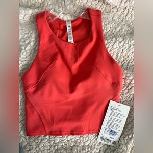 Pink lululemon razorback invigorate train tank size 2